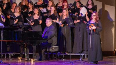 Piano player and choir singing